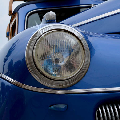 Close-up of vintage car headlight, blue.