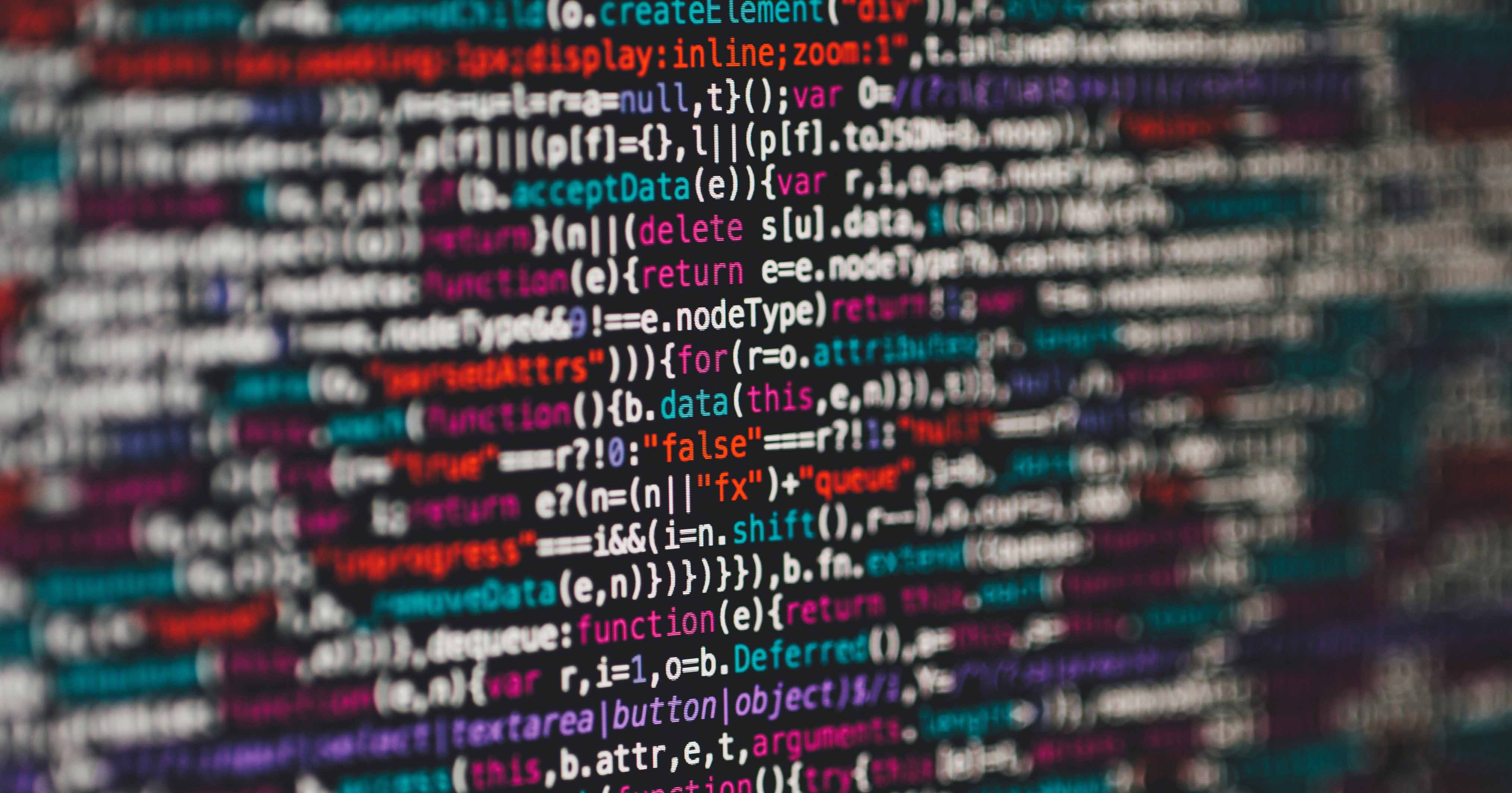 Colourful computer code on a black screen.