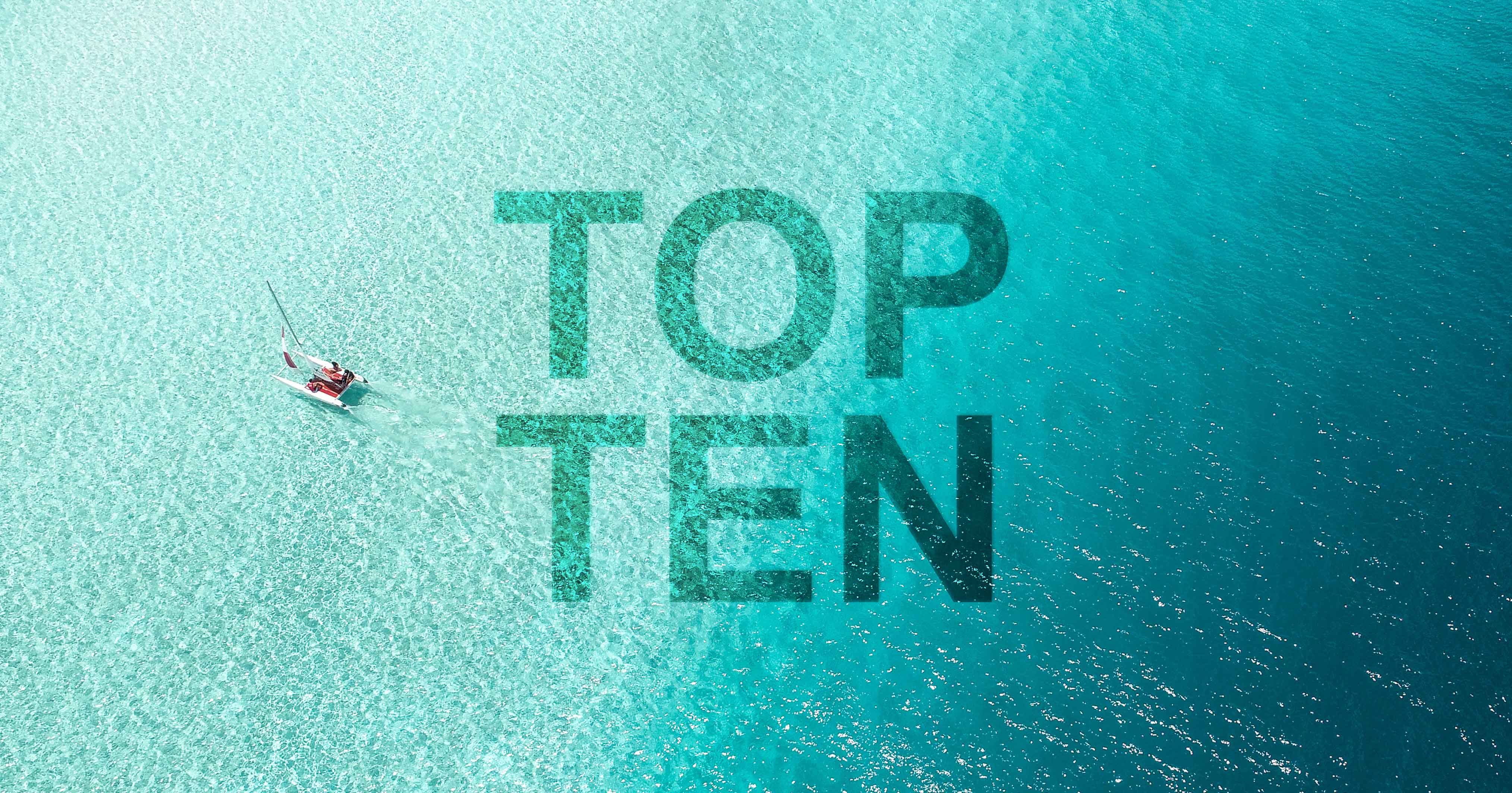 Graphic depicting the words 'Top Ten' superimposed over tropical lagoon.